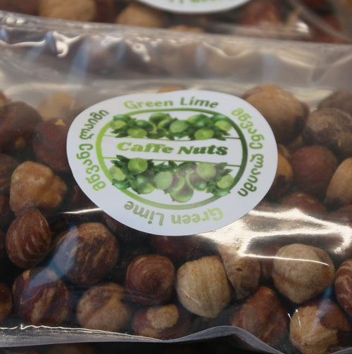 Three packages of nuts with visible labels on a clear background
